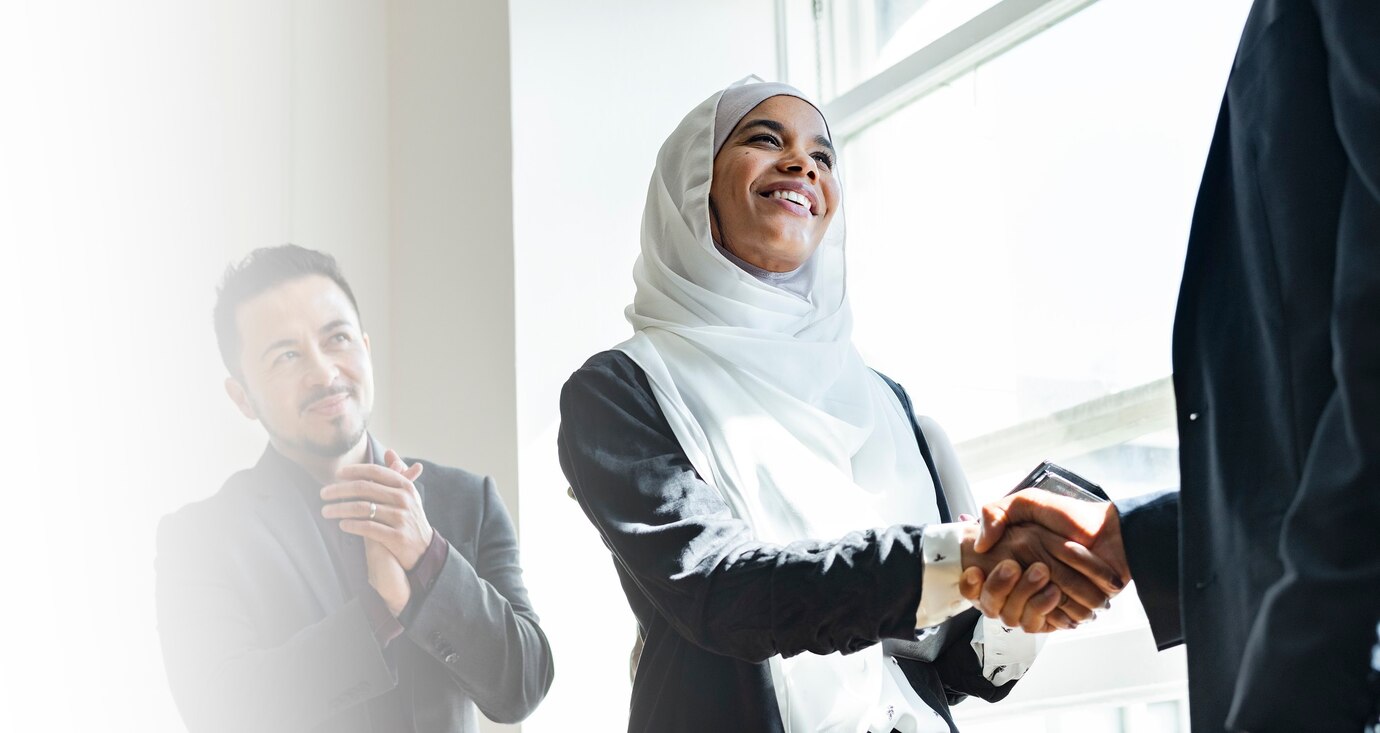 muslim-businesswoman-shaking-hands-business-agreement_53876-95776